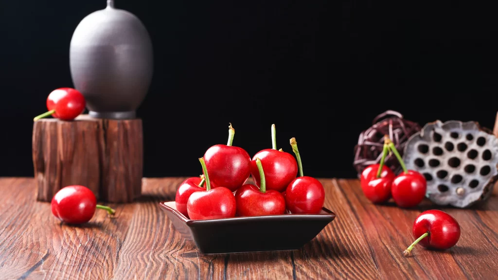 Cherries Wooden Table Black Background Ceramic Dish Decorative Objects Still Life