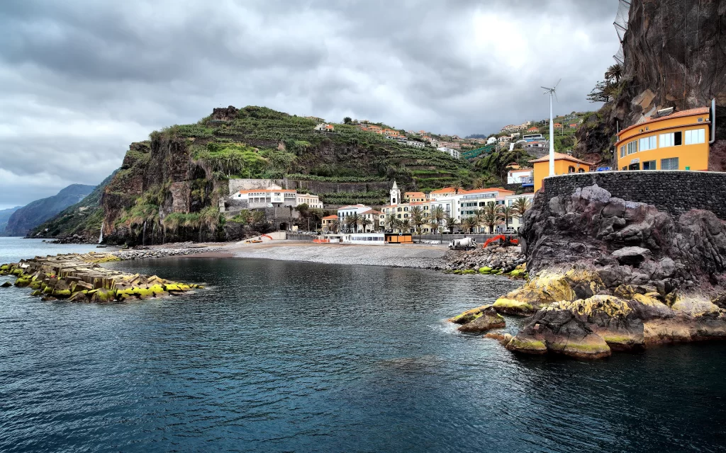 Coastal Town Rocky Shoreline Buildings Greenery Ocean