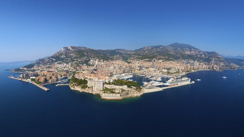 Aerial view coastal city blue sky sea buildings mountains