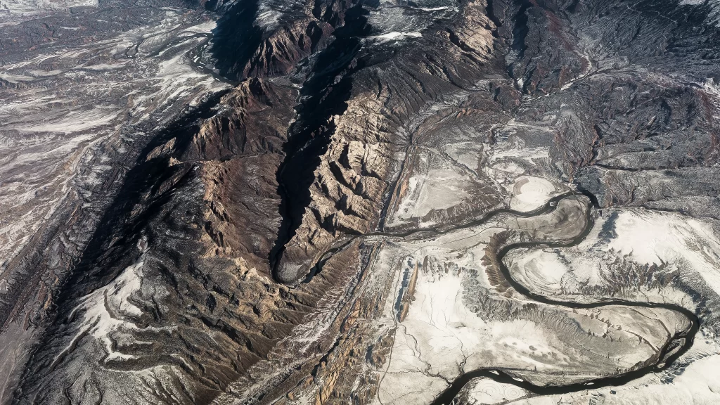 Aerial View Mountainous Terrain River Snow Rugged Landscape Natural Beauty