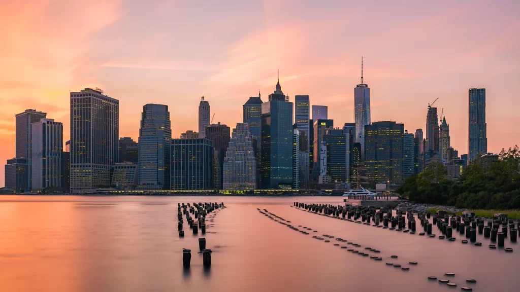 Cityscape Sunset Skyscrapers Water Serene Reflection
