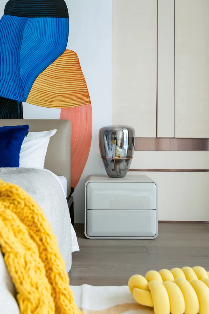 Contemporary Bedroom Taupe Bedside Table Glass Lamp Multicolored Wall Art
