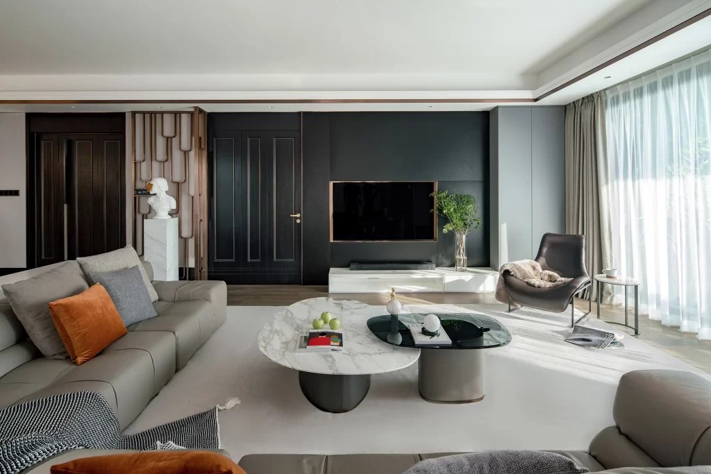Contemporary Living Room Gray Sofa Black Coffee Table Neutral Tones