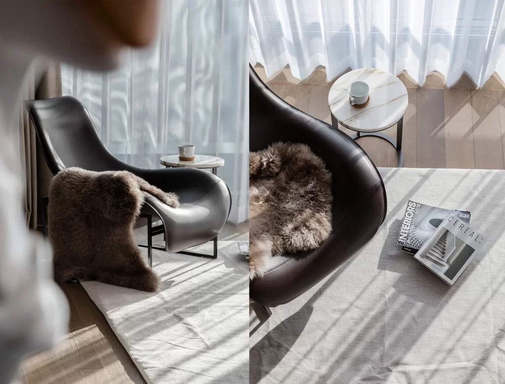 Contemporary Reading Nook Black Leather Chair Fur Throw White Curtains