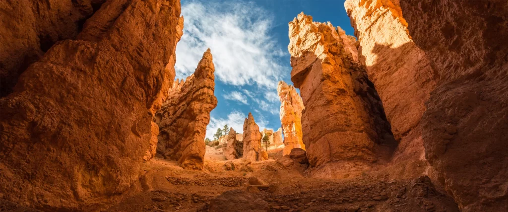 Desert Canyon Towering Rock Formations Blue Sky Sunlight Rugged Terrain Natural Beauty