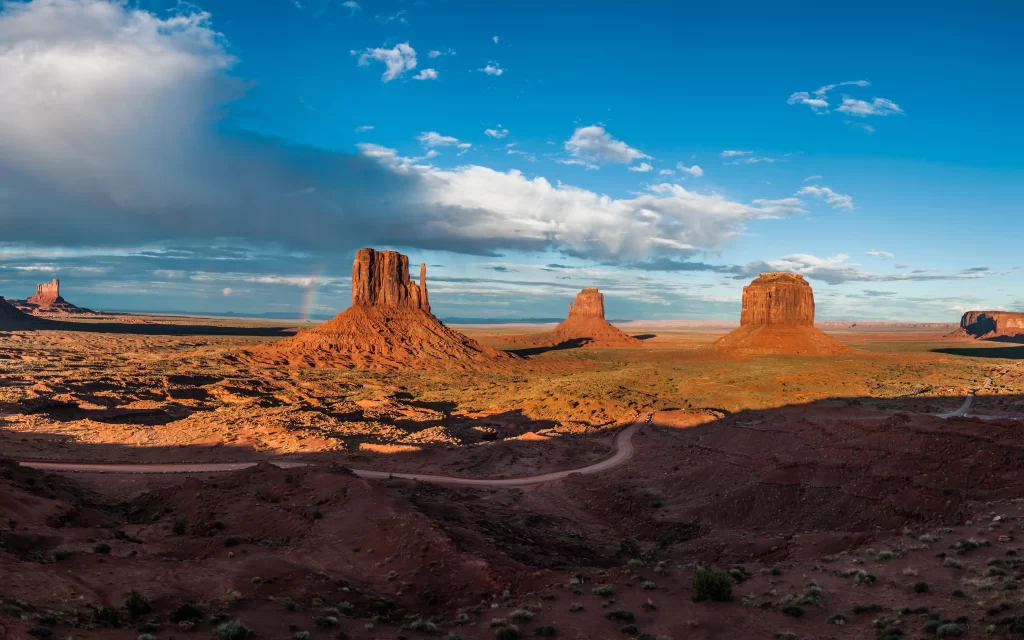 Desert Landscape Red Rock Formations Clear Sky Scattered Clouds Natural Beauty