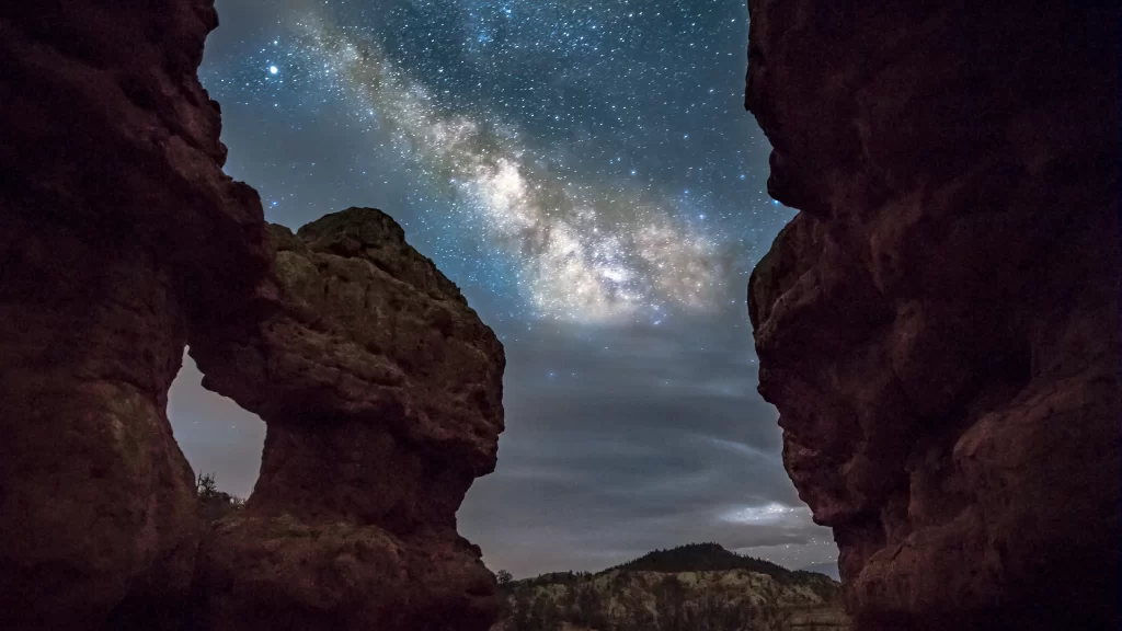 Galaxy stars night sky rock formations landscape astronomy
