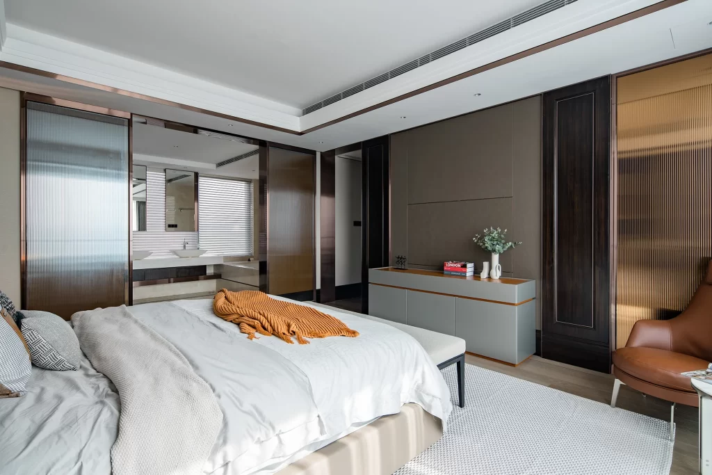 Modern Bedroom Gray Bedside Table Brown Chair Neutral Tones