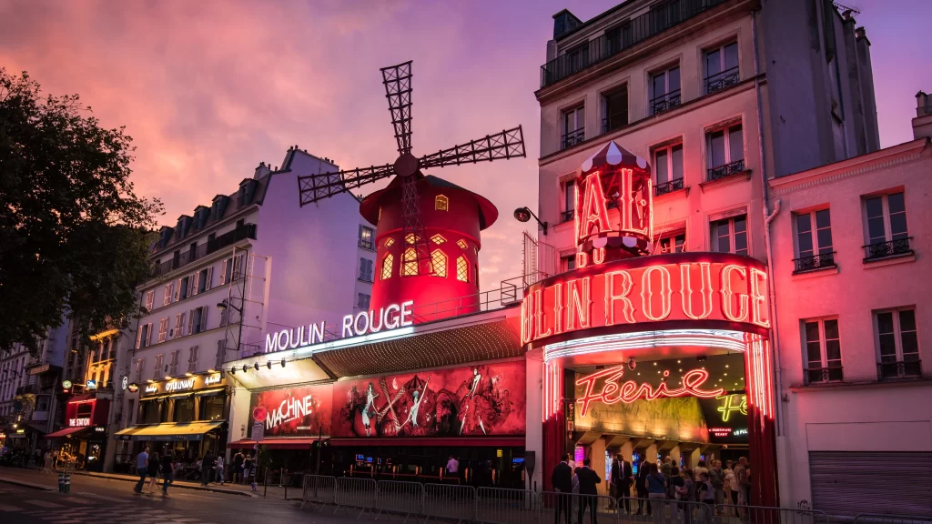 Moulin Rouge Paris windmill cabaret neon lights evening