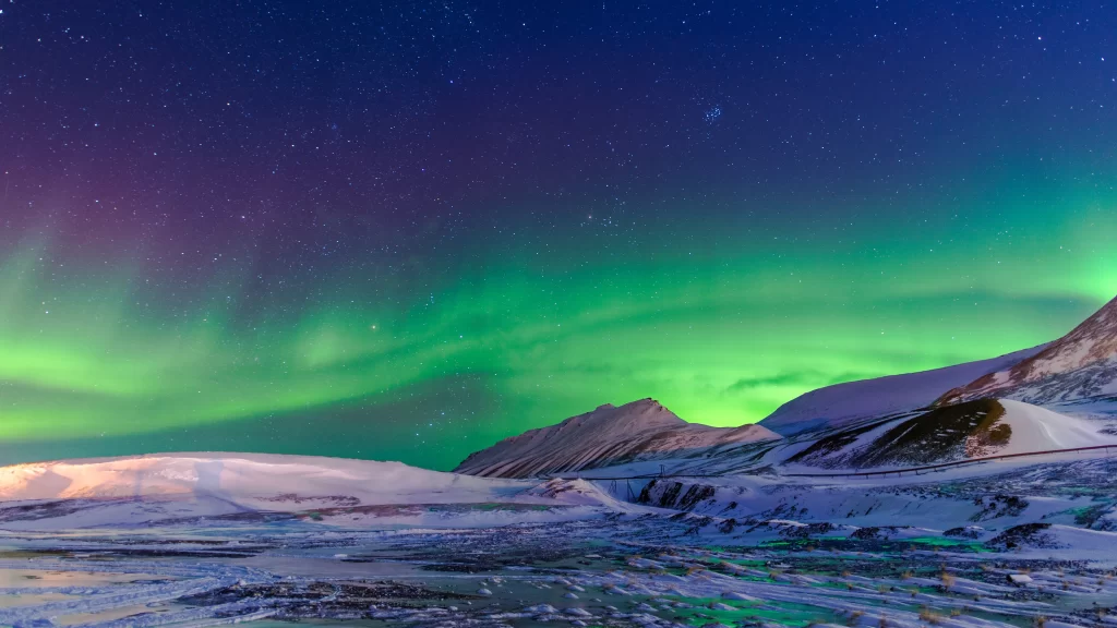 Northern Lights snow mountains stars night sky