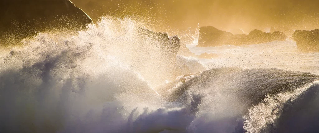 Ocean Waves Sunlight Splashes Rocks Golden Glow