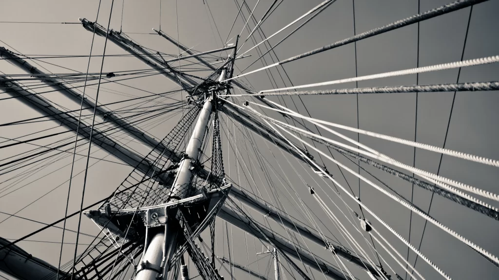 Sailing ship rigging ropes mast sky monochrome