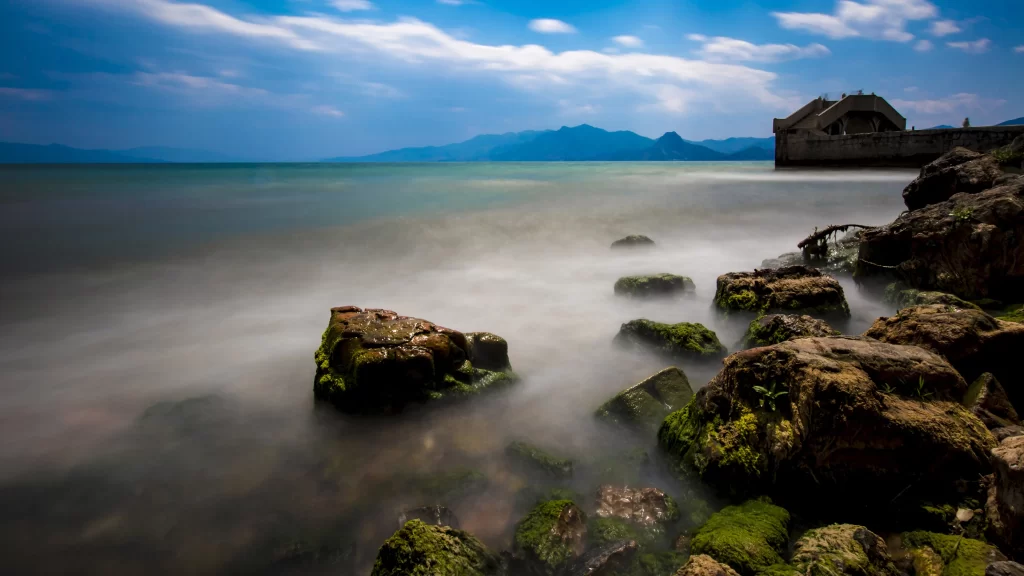 Seaside Rocks Misty Water Mountains Sky