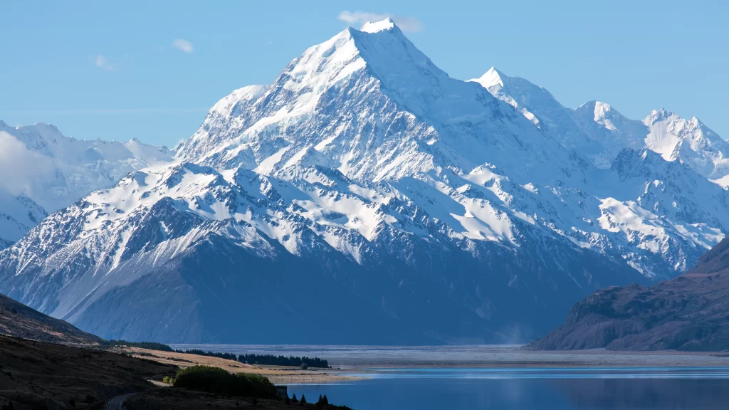 Snowy Mountain Clear Sky Tranquil Lake Rugged Terrain Natural Beauty