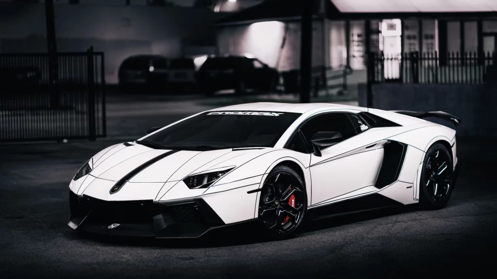 Sports car luxury white black wheels nighttime