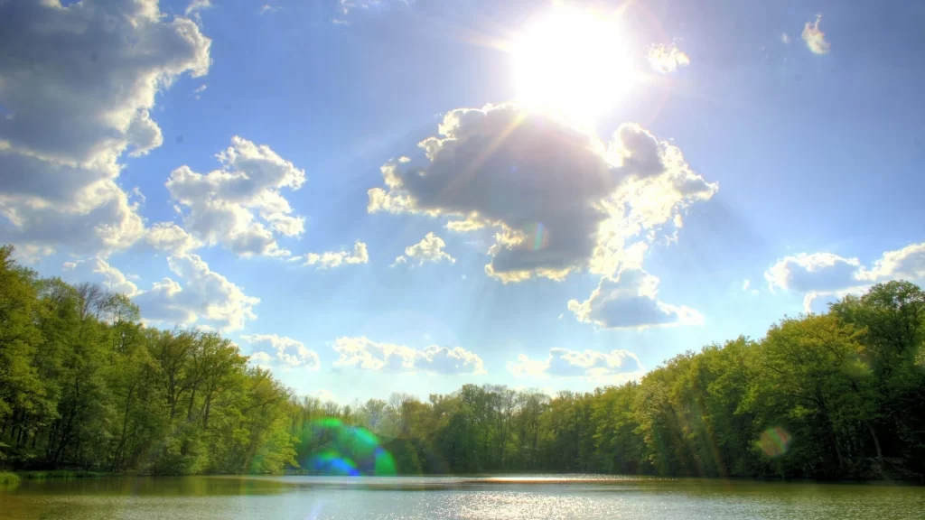 Sunlight clouds lake trees reflection nature