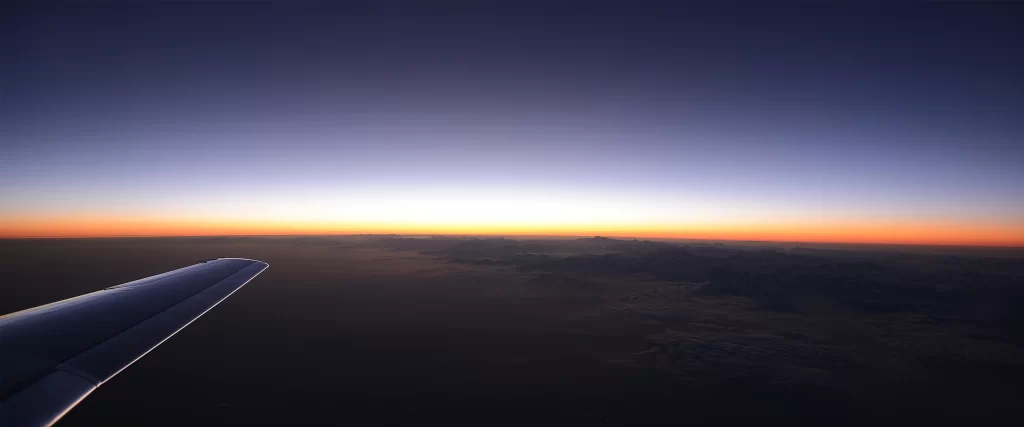 Sunset Airplane Wing Sky Clouds Horizon