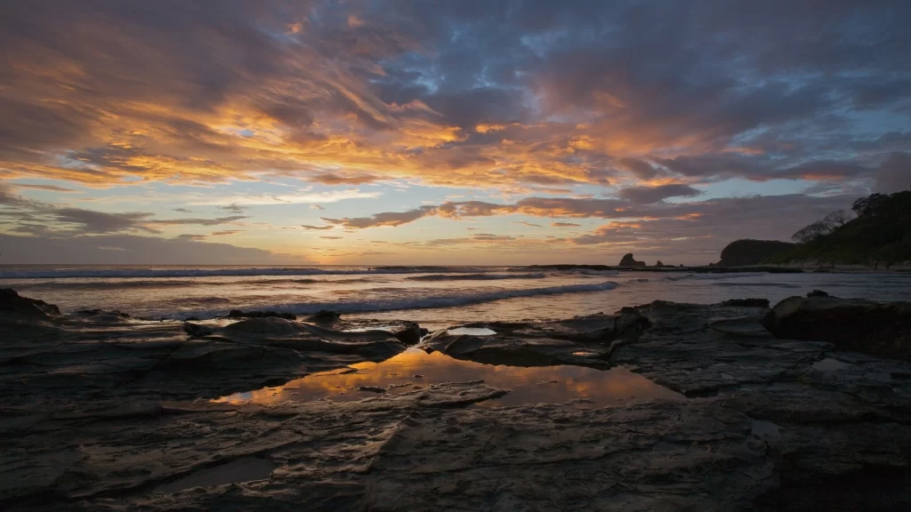 Sunset beach sky clouds ocean rocks