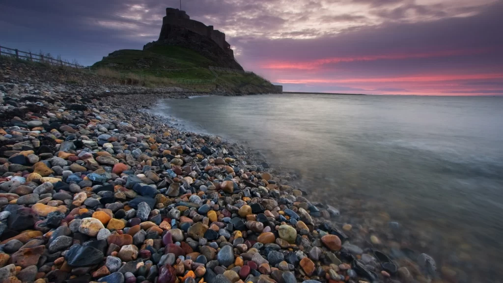 Sunset beach stones castle sky clouds