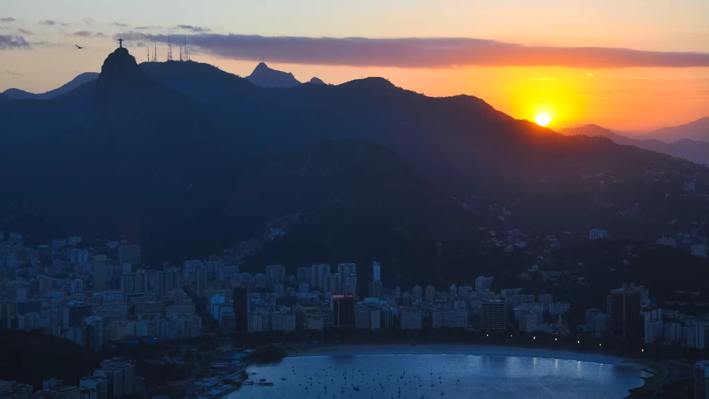 Sunset cityscape beach mountains skyline ocean