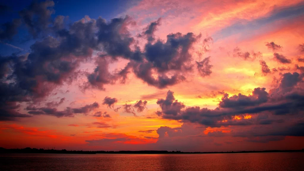 Sunset clouds sky water reflection colors