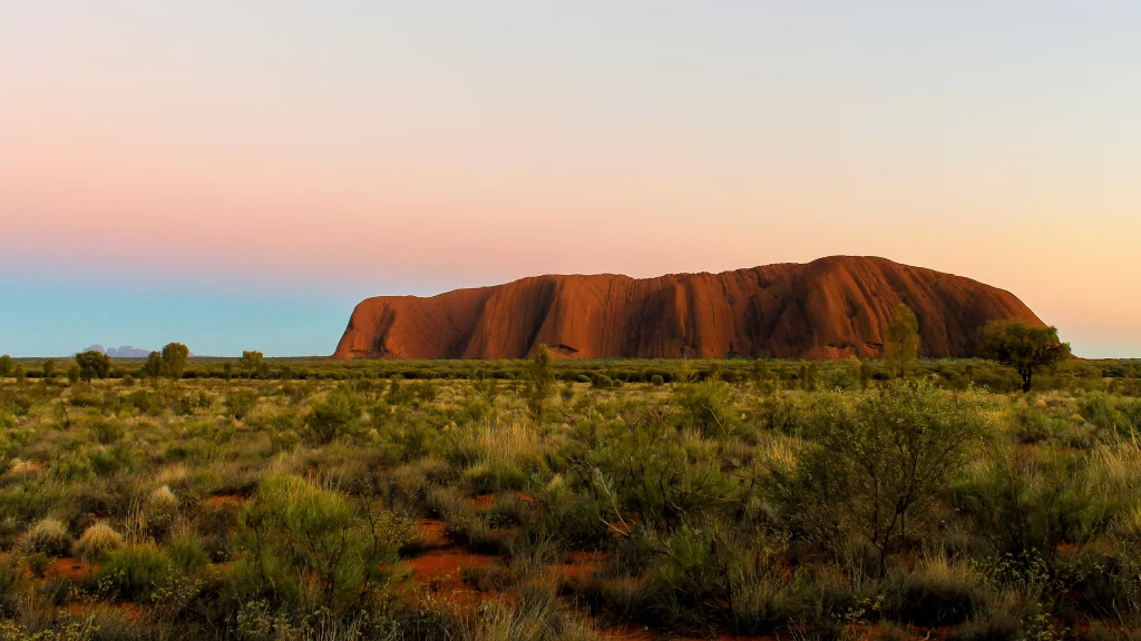 Sunset desert rock formation vegetation sky landscape