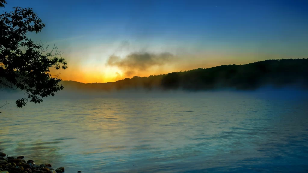 Sunset lake mist trees sky reflection