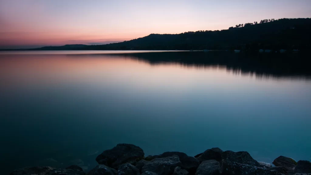 Sunset lake reflection mountains rocks sky