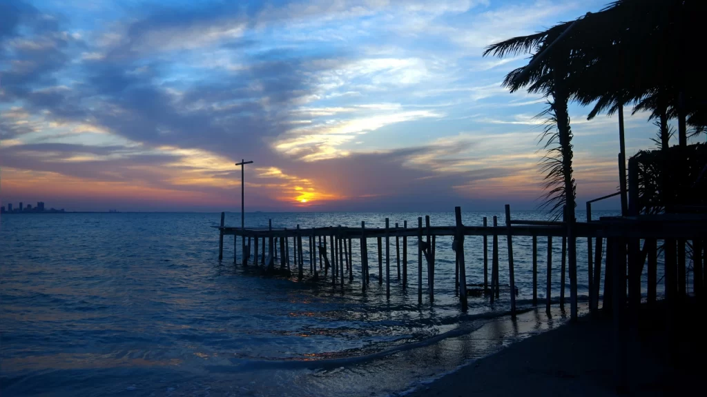 Sunset pier ocean clouds sky palm trees
