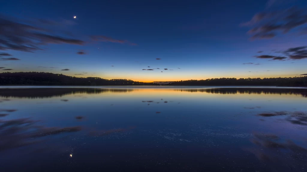 Sunset reflection lake sky clouds moon
