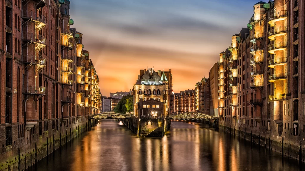 Sunset river buildings lights bridge reflection