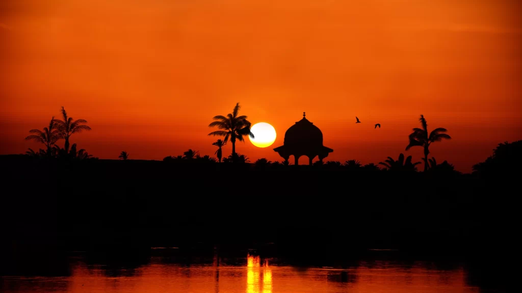Sunset water reflection trees gazebo birds