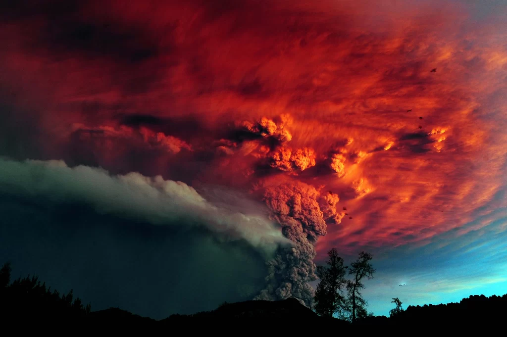 Volcano eruption ash cloud red sky dramatic landscape natural disaster fiery exp