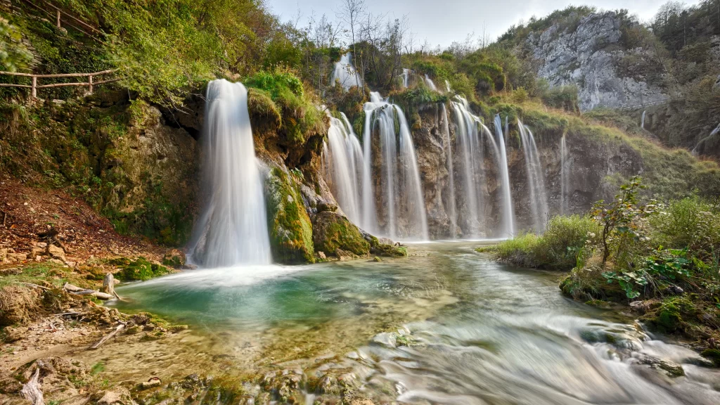 Waterfall nature landscape serene greenery flowing