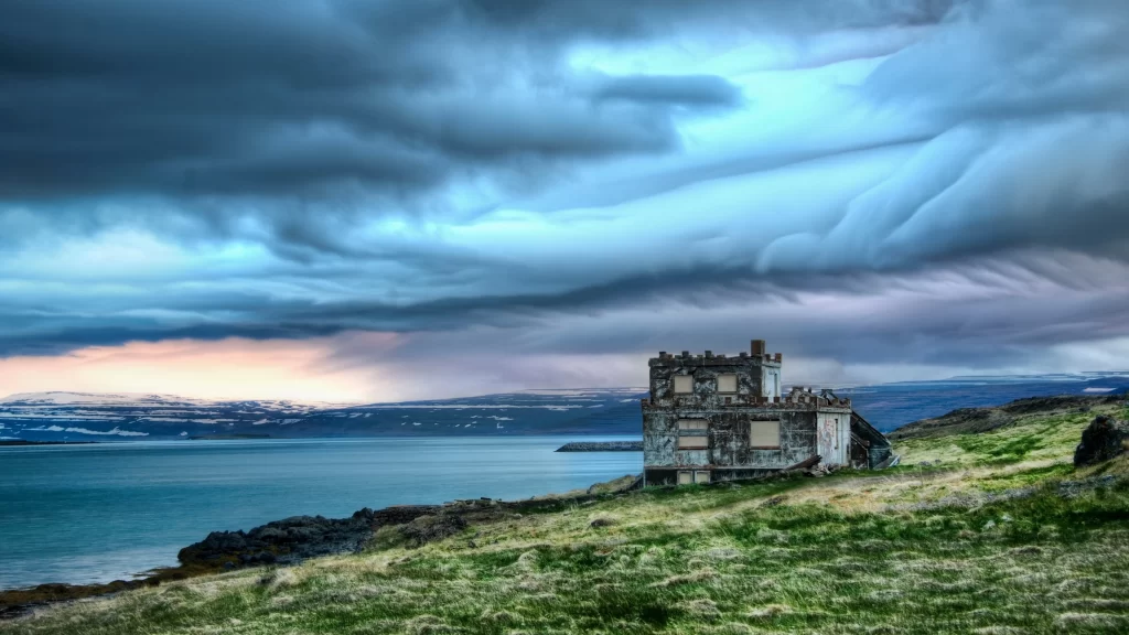 abandoned building dramatic clouds ocean view rugged landscape natural beauty se