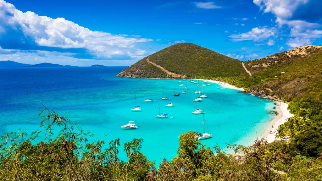 beach boats ocean sky clouds greenery