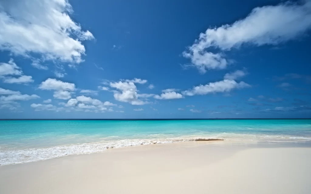 beach ocean sky clouds sand water