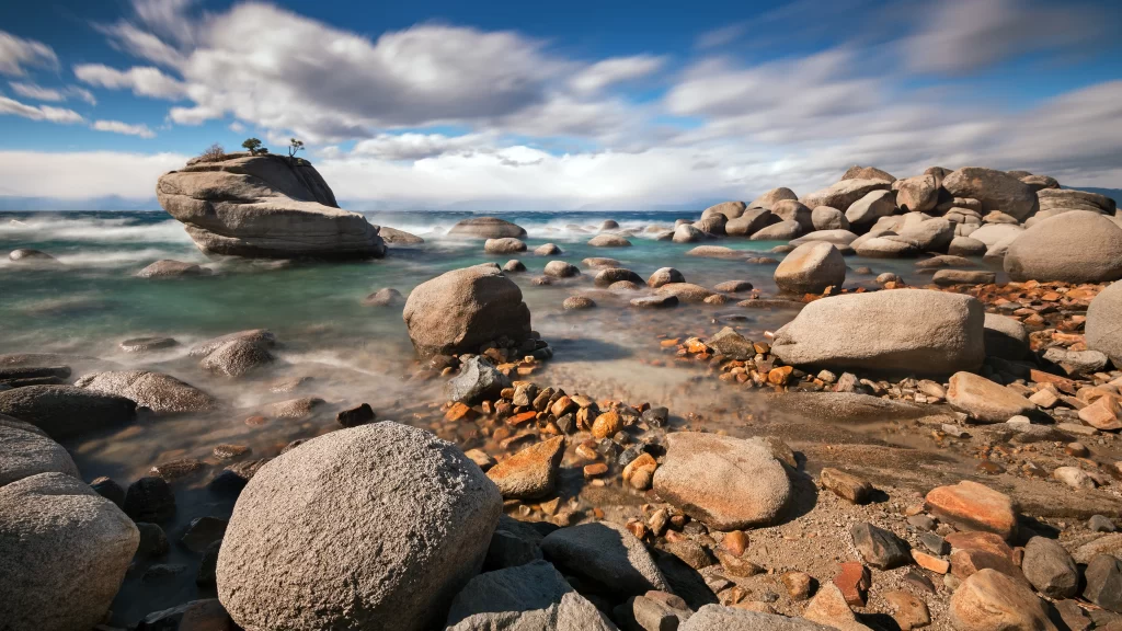 beach rocks ocean waves sky clouds