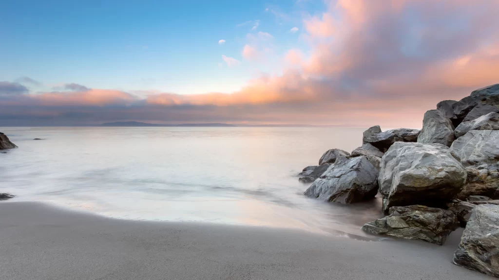 beach rocks sky clouds sunset calm