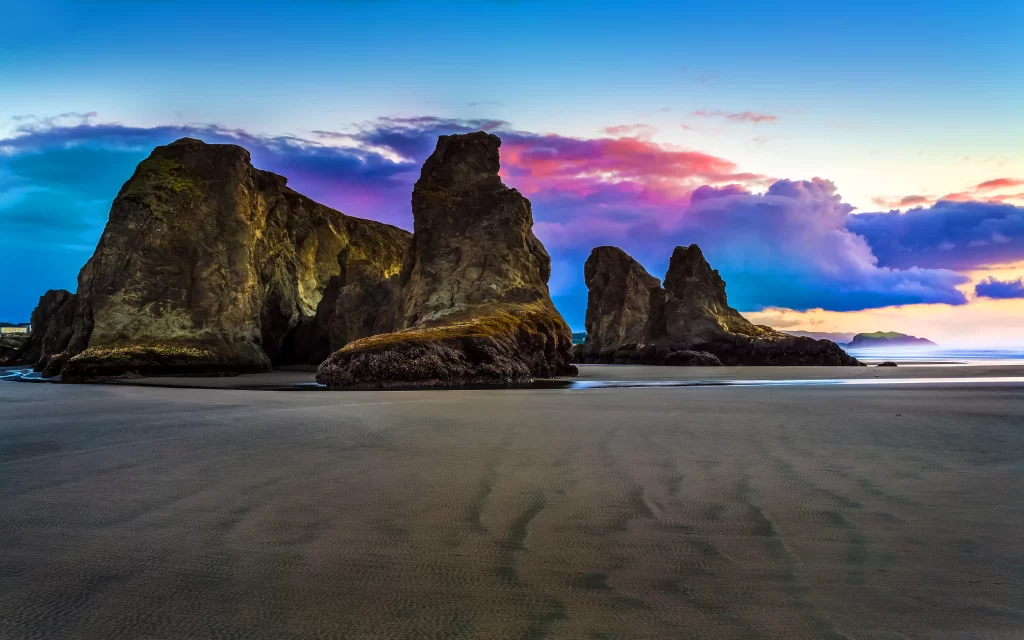 beach sunset rocks sky clouds ocean