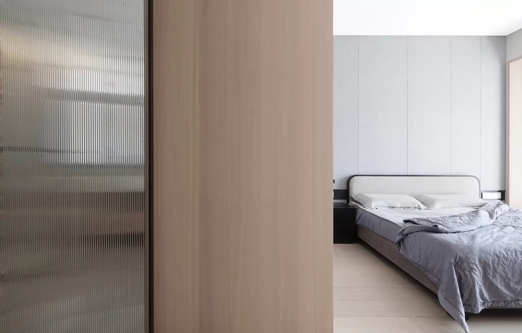 Bedroom Neutral Tones Simple Bed Wooden Paneling Soft Lighting