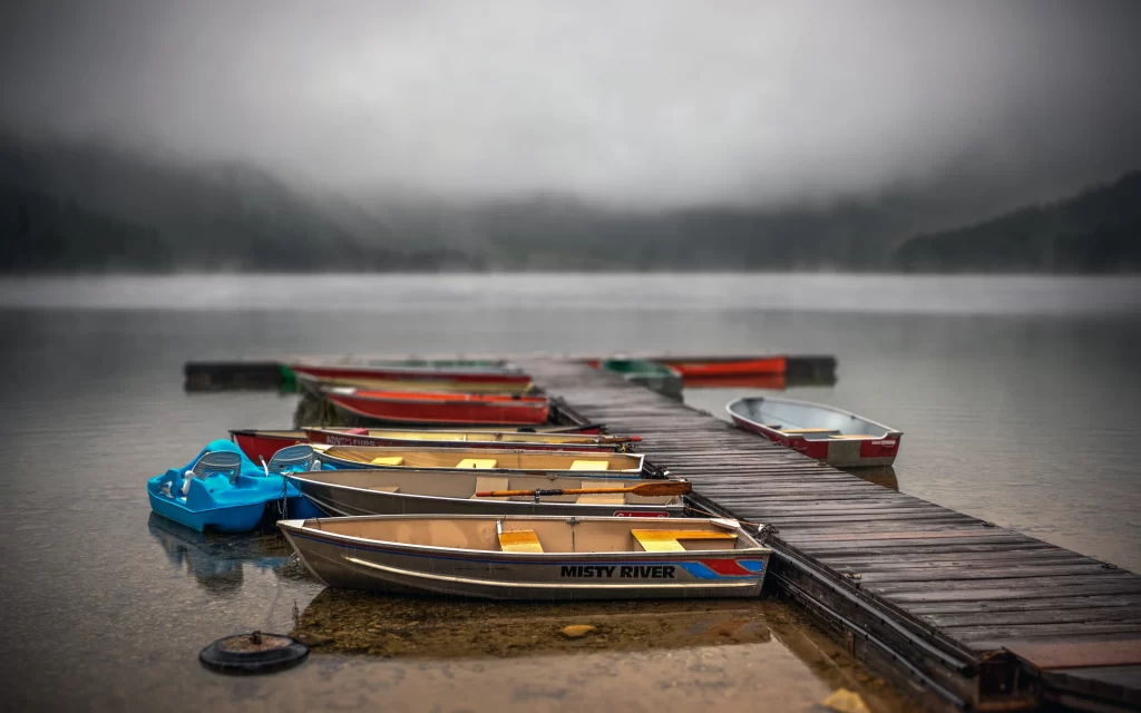 Boats dock misty lake calm serene