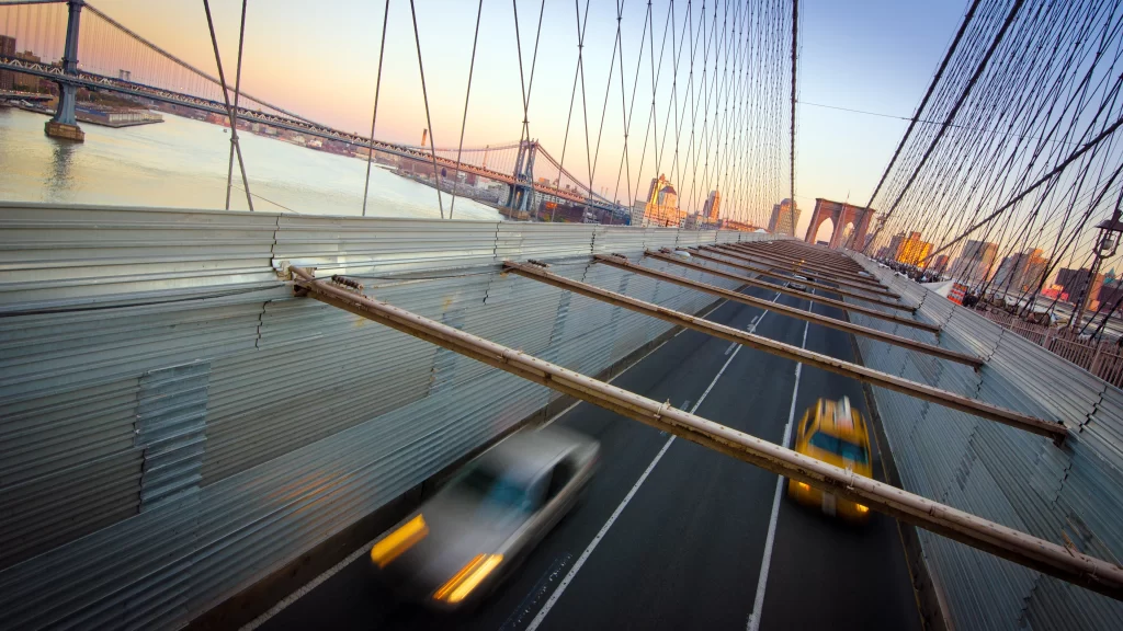 bridge cars sunset cityscape traffic suspension