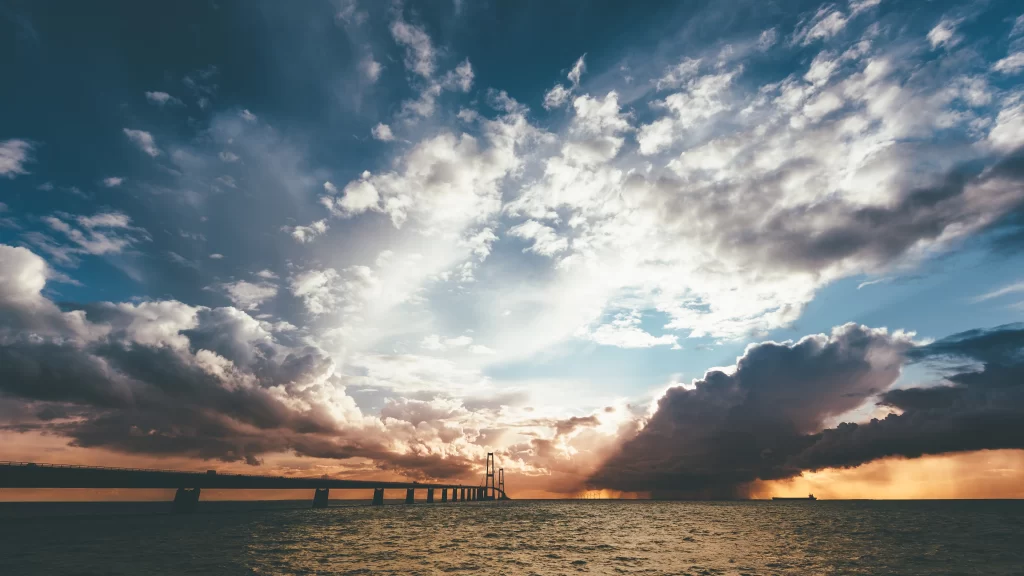bridge clouds sunset ocean sky