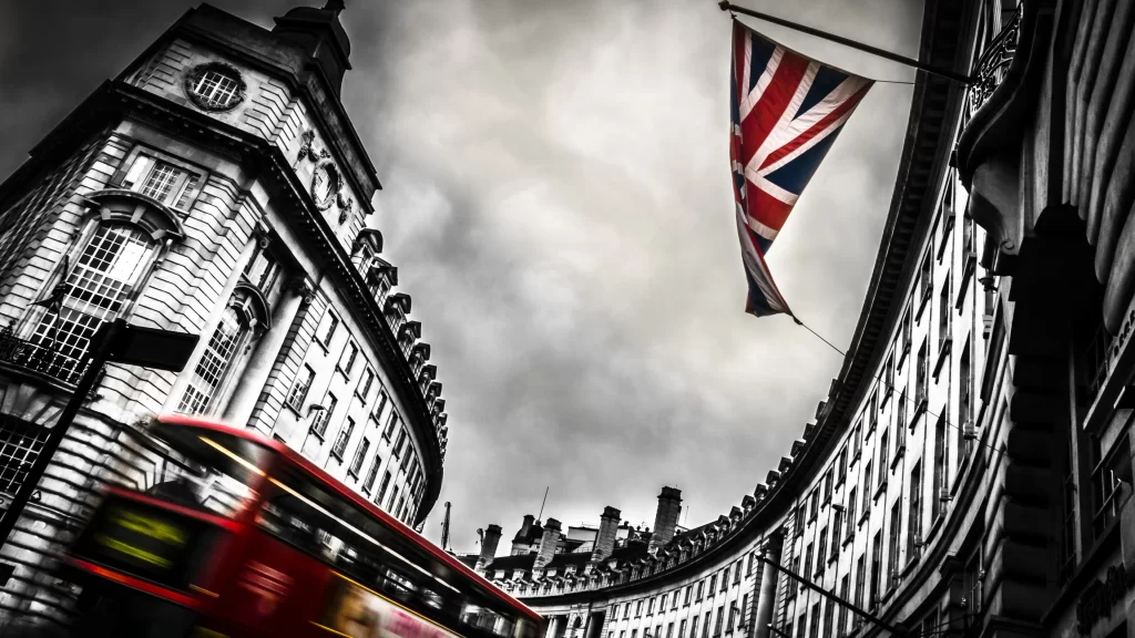 bus flag buildings street clouds architecture