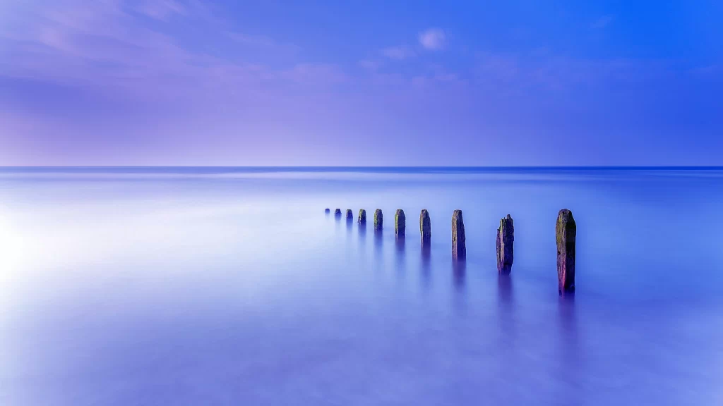 Calm Water Wooden Posts Twilight Serene Reflection Tranquility