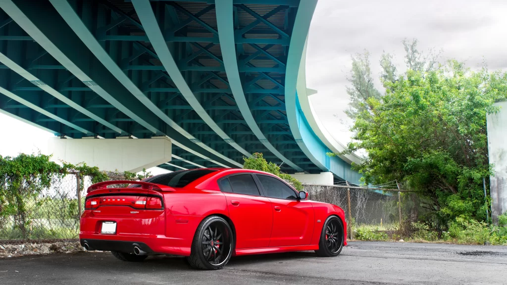car bridge red sky green