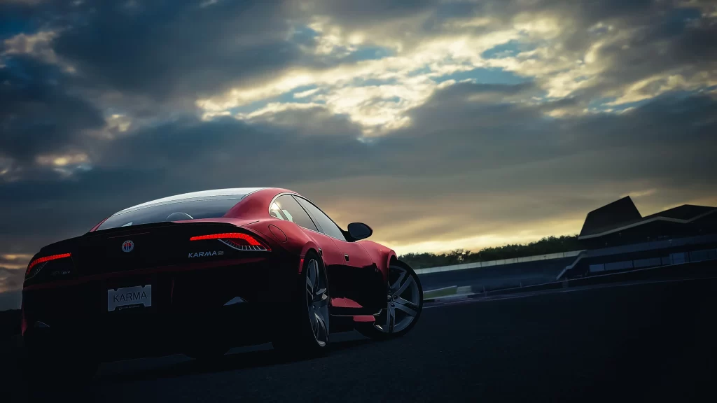 car red sunset clouds road building