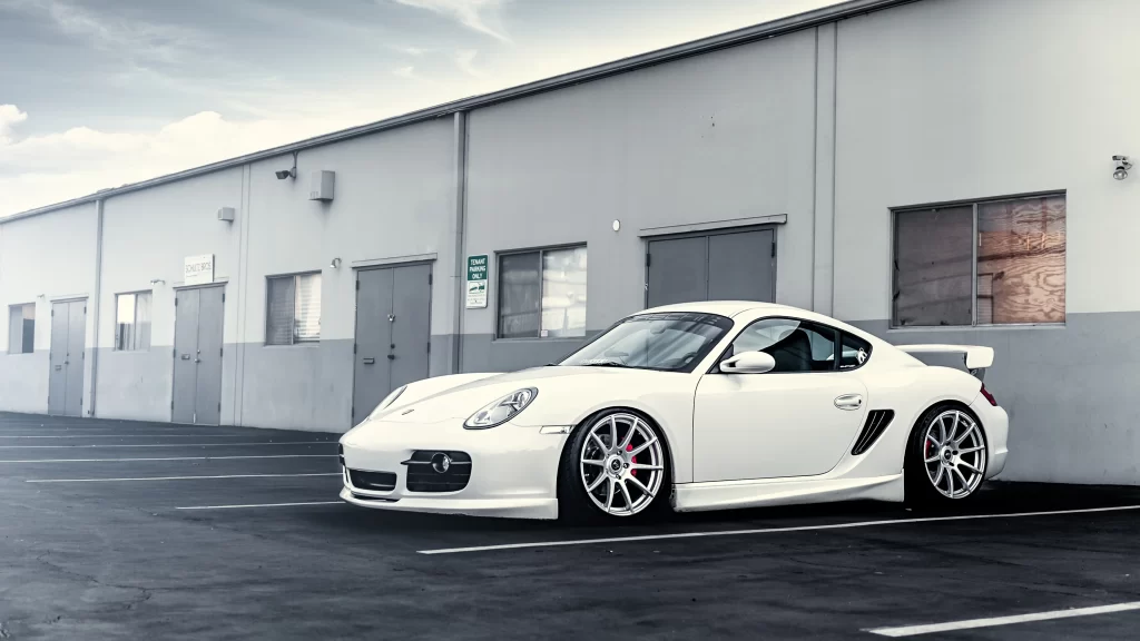 car white parking lot building wheels windows