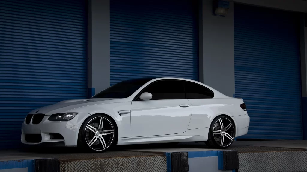 car white sporty wheels garage